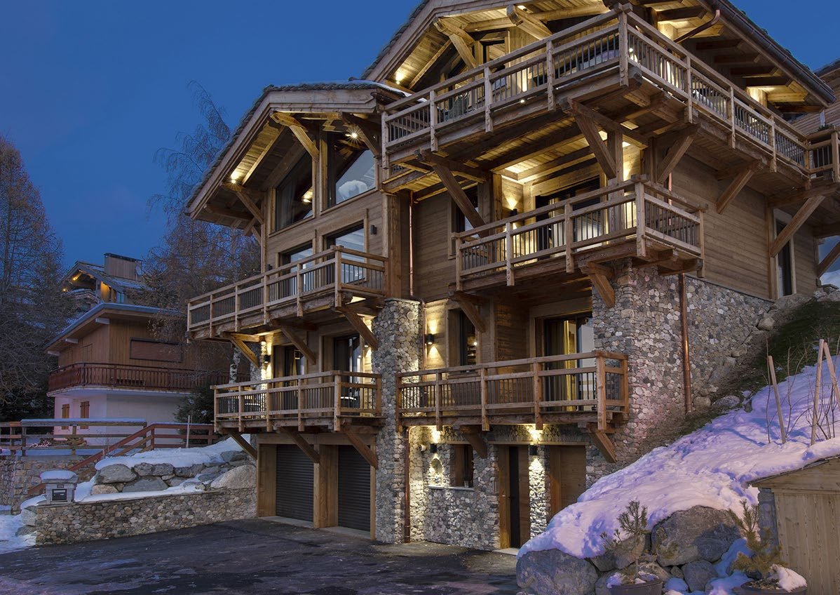 Chalet La Voie Lactée illuminated at dusk, Courchevel